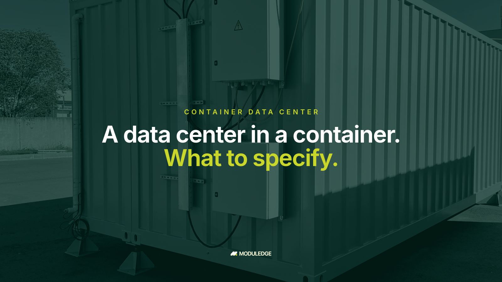 White modular data-center container outdoors with attached cooling equipment, with the headline "A data center in a container. What to specify."