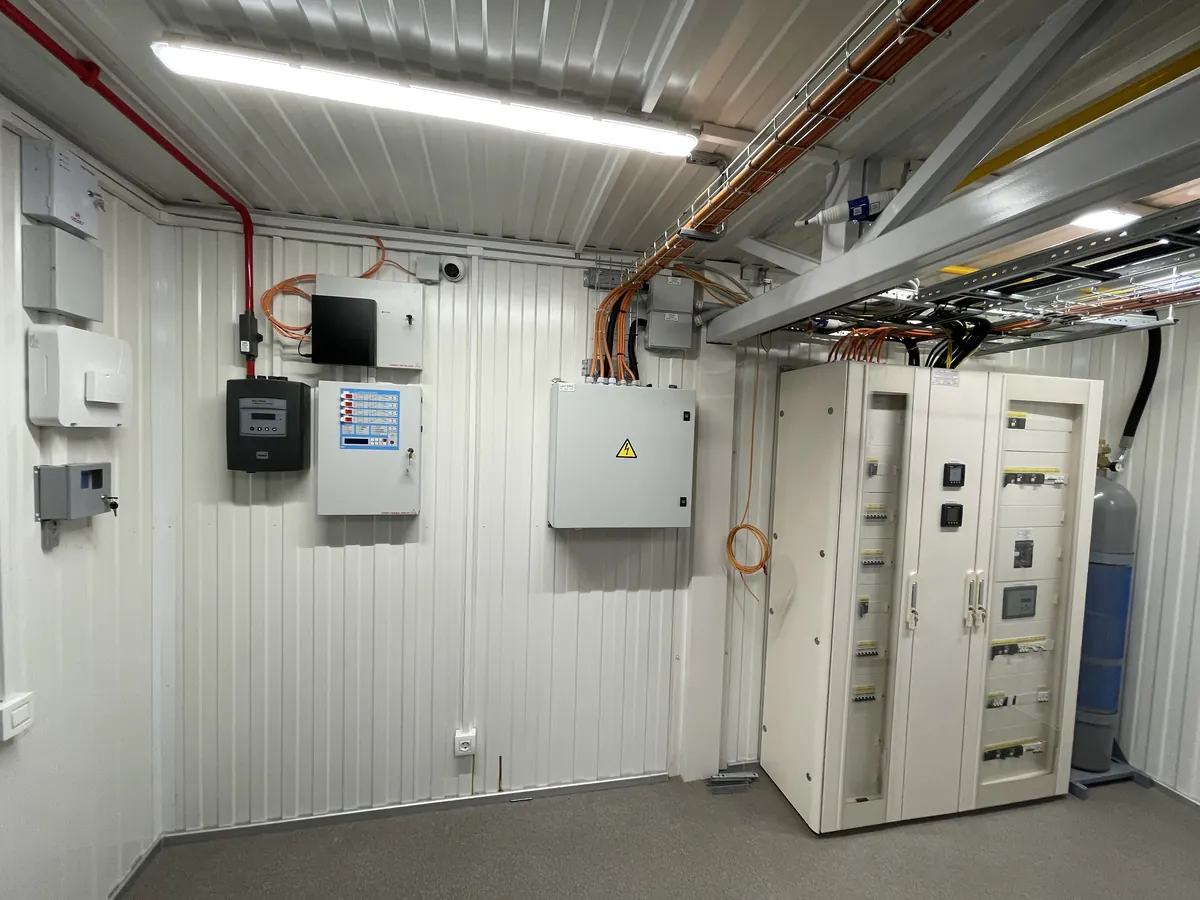 Electrical distribution cabinets mounted beside the IT racks inside a module